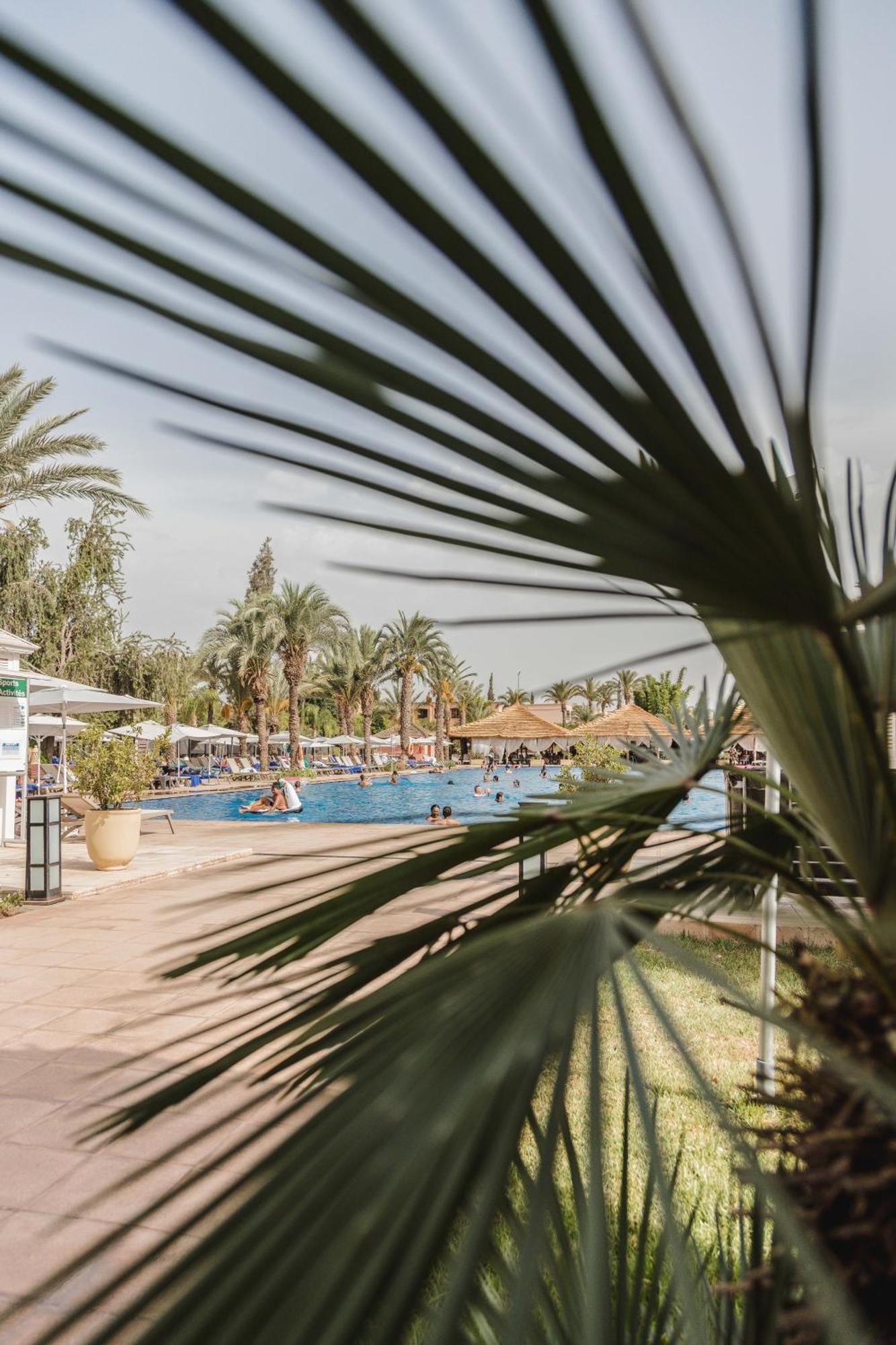 Kenzi Menara Palace & Resort Марракеш Экстерьер фото A swimming pool in a hotel in Tunisia