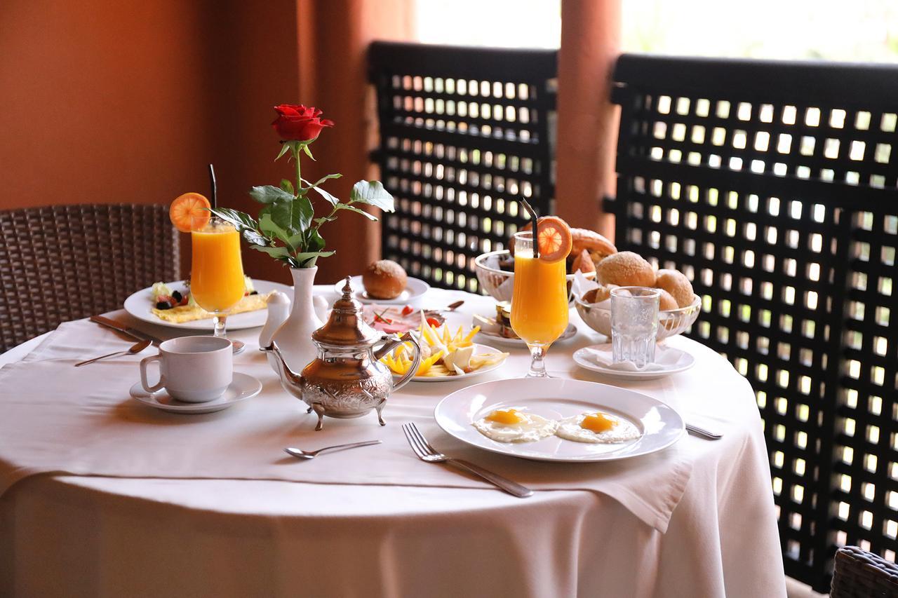 Kenzi Menara Palace & Resort Марракеш Экстерьер фото A breakfast table